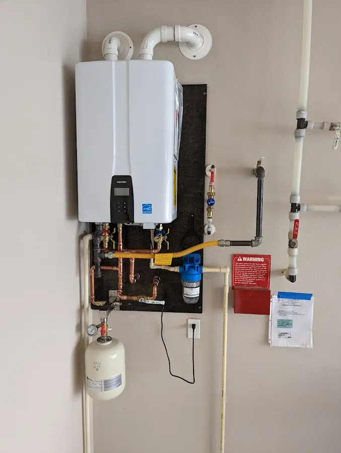 Professional plumber installing copper piping in a Trent Woods home